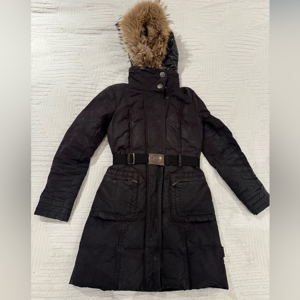 Moncler winter coat with detachable fur-trimmed hood.